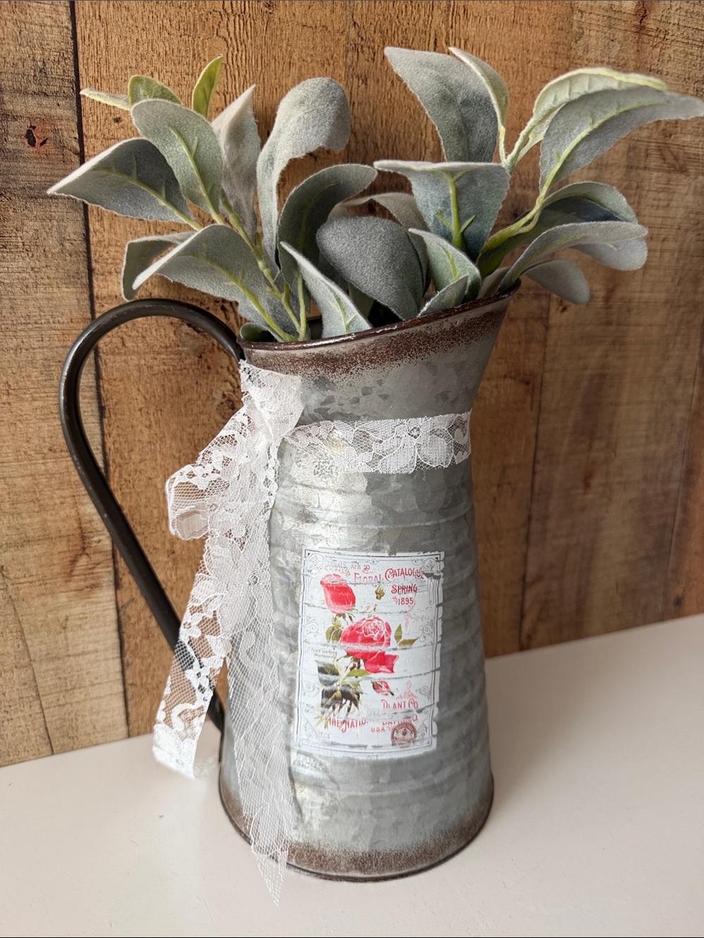 Vintage-Style Galvanized Metal Pitcher with Lace and Floral Accent